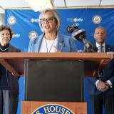 Rep. Kelly speaks at a press conference, condemning Trump's budget cuts, frozen federal funds, firings of federal workers.