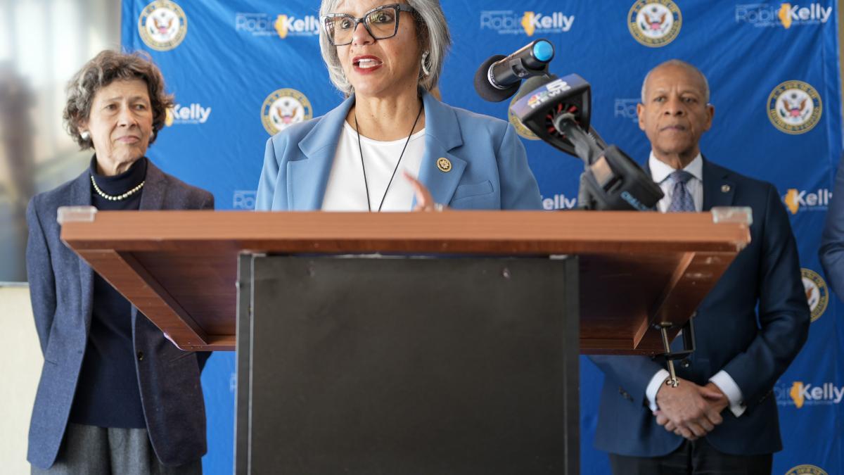 Rep. Kelly speaks at a press conference, condemning Trump's budget cuts, frozen federal funds, firings of federal workers.