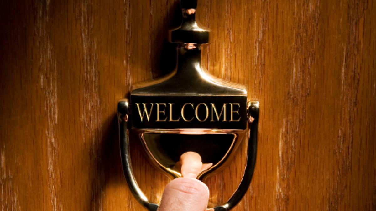 welcome sign on an office doorknocker